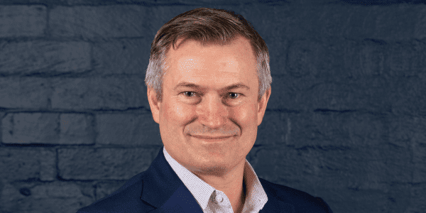 headshot of ian campbell on grey background