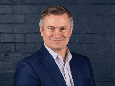 headshot of ian campbell on grey background